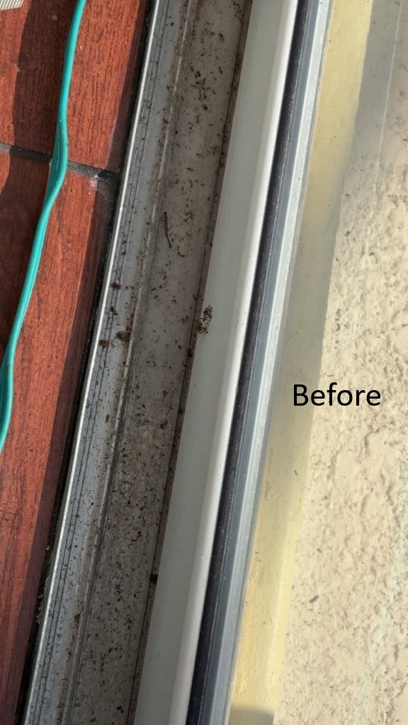 Dirty sliding glass door tracks before professional house cleaning service