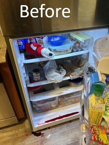 Dirty refrigerator interior with spills and food residue before move out cleaning in Tampa FL