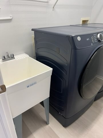 Laundry room cleaned and floors mopped after professional house cleaning in Lutz