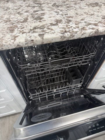 Dishwasher cleaned inside and out after professional house cleaning in Lutz