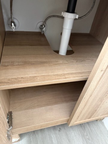 Under-sink cabinets cleaned after professional house cleaning in Carrollwood