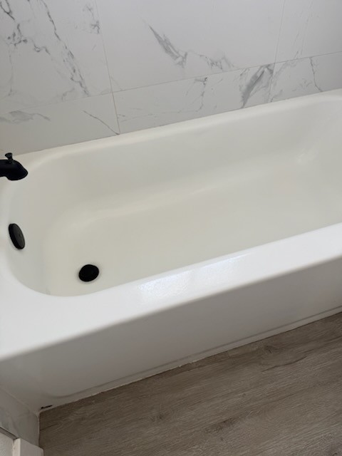 Bright white bathtub cleaned and scrubbed after professional house cleaning in Tampa