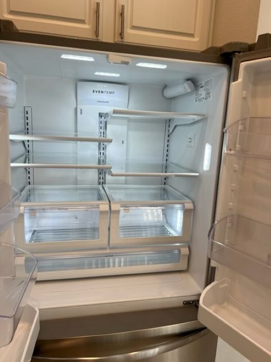 Refrigerator interior deep cleaned and sanitized after professional house cleaning in Carrollwood