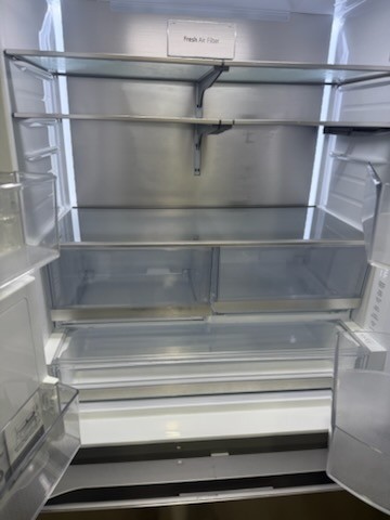 Deep cleaned refrigerator interior after professional house cleaning in Lutz