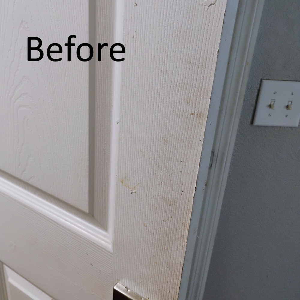 Door with dirt and fingerprints before Evermaid Cleaners move out cleaning service in Tampa, FL