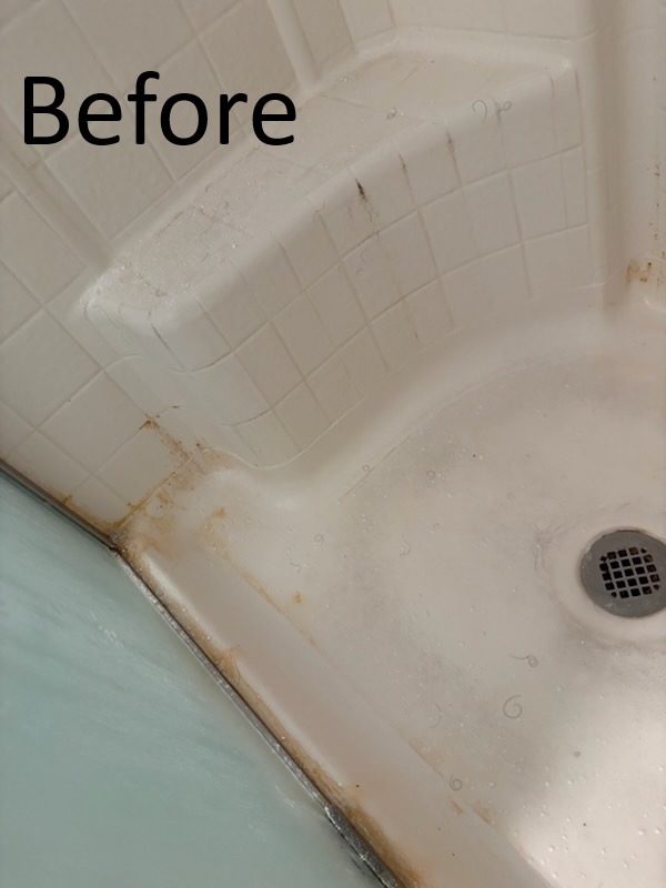 Dirty Tampa apartment shower with soap scum and hard water buildup before cleaning